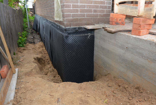 SJ Waterproofing Pros technician performing targeted Interior Drainage System assessment in Charlotte, NC